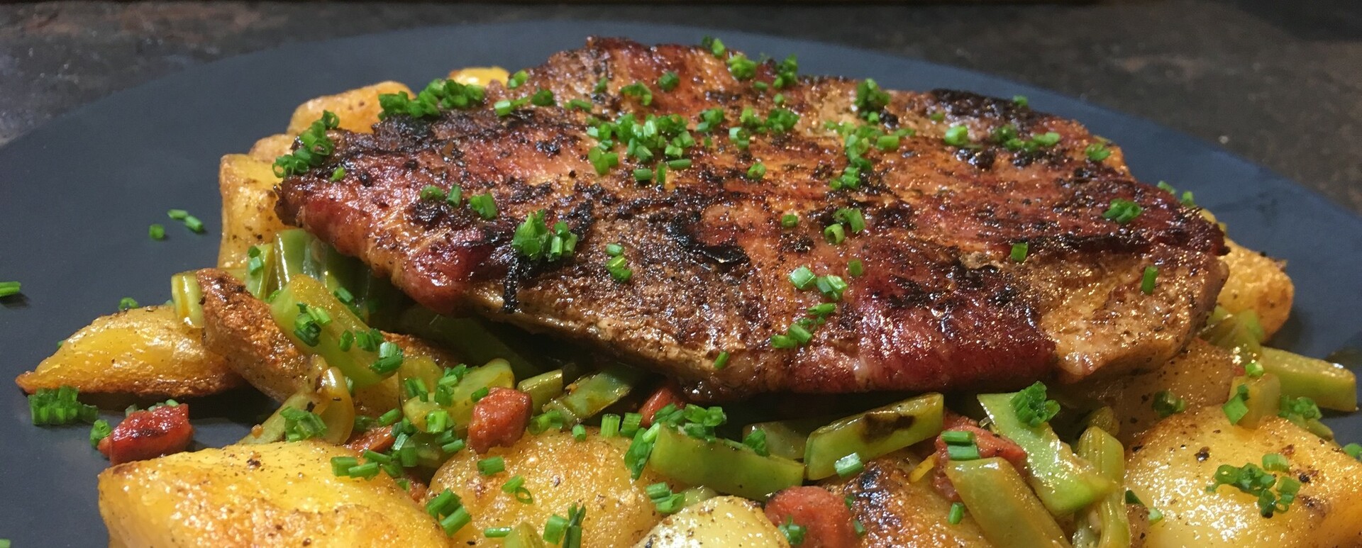Houthakkerssteak met snijbonen, aardappel en chorizo 